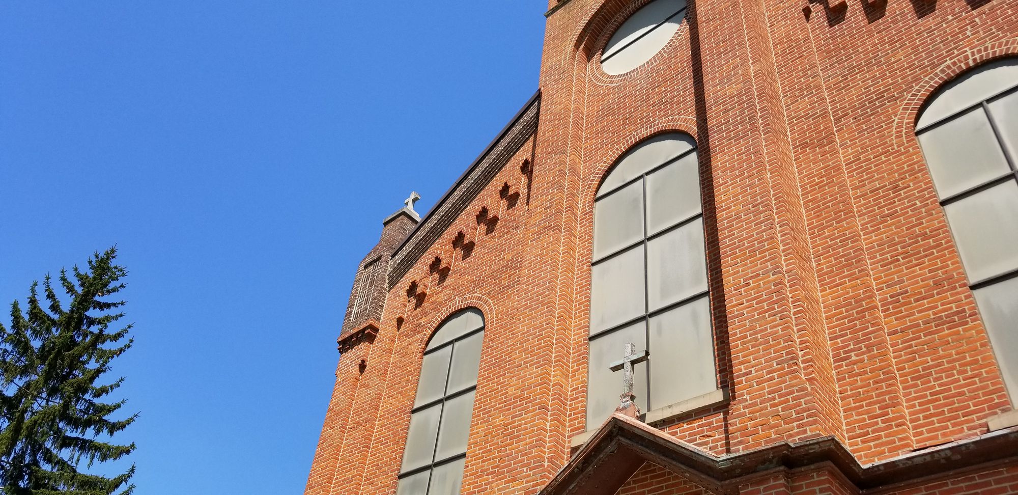 The arched windows and brick of St. Mary church in Avilla